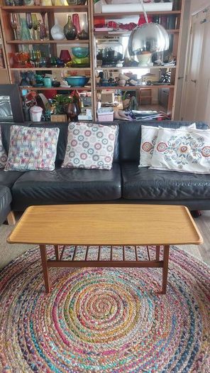 Unusual and Practical Mid-Century Modern Wooden Coffee Table with a Hard-Wearing Wood-Patterned Melamine Top and Slatted Magazine Shelf