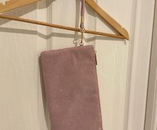 Pink glitter clutch with wrist strap
