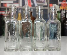 140 - Set of 4 Vintage Cork Distilleries Company Whisky Small Collectible Decorative Clear Glass Bottle