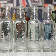 140 - Set of 4 Vintage Cork Distilleries Company Whisky Small Collectible Decorative Clear Glass Bottle