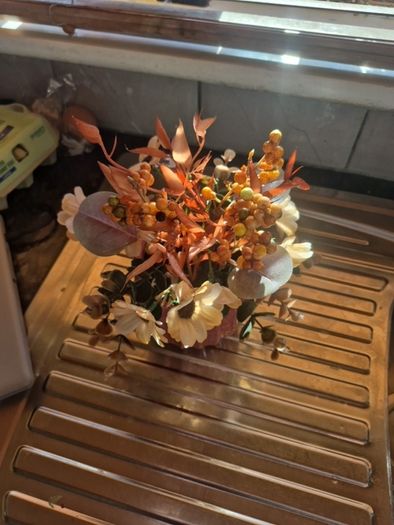 Small orange and tan fake flowers