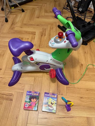 Kids bicycle-game console Fisherprice smart cycle with 3 cartridges
