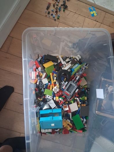 Big box of lego with mini figurines open to offers