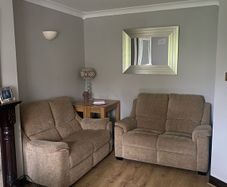 Pair of Parker Knoll 2 seater sofas with matching footstool