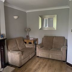 Pair of Parker Knoll 2 seater sofas with matching footstool