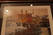 Framed print of  Snow-Covered Buildings by a River by Fritz Thaulow (1847 - 1906).