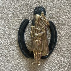 Unique Brass Door Knocker featuring a Bagpiper