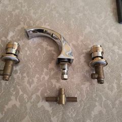 Chrome Bath Taps with Gold Trim.
