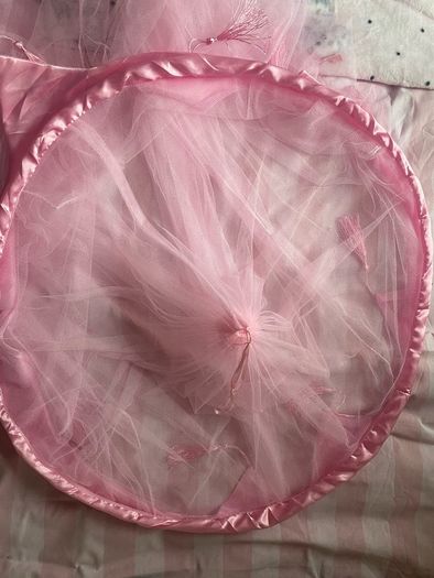 Beautiful pink tulle princess bed canopy.