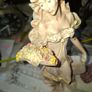 Beautiful Old Figurine distinctive Art Nouveau style of Italian sculptor, depicting an elegant woman in a flowing pastel gown holding a floral arrangement, Postage Available or Collection Image 3