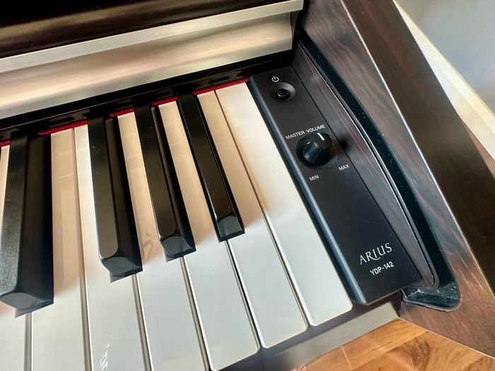 Yamaha Arius YDP-142 Digital Piano with rosewood finish and matching stool