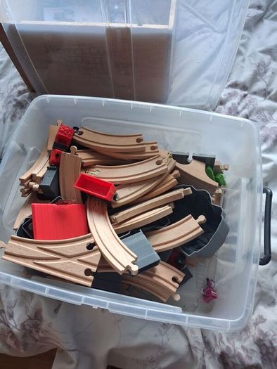 wooden train track set with wooden trains and accessories.