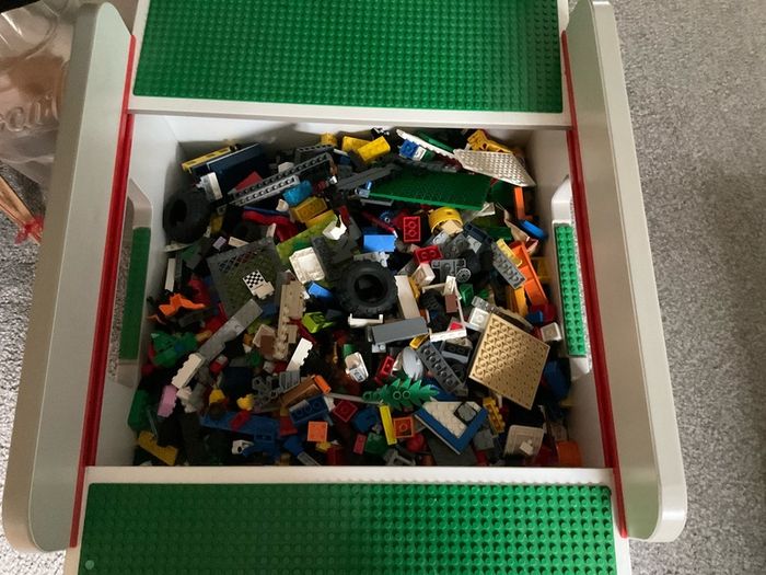 lego box and mixed lego pieces