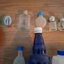 Empty holy water bottles and other religious items Image 4