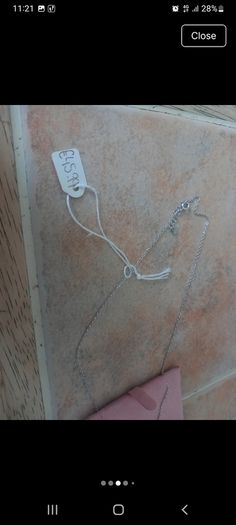 silver necklace with green stone