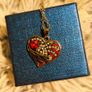 Heart-Shaped Pendant Necklace with Red Glass Heart and Wing Details Image 2