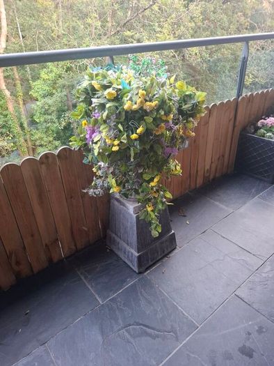 Cast garden Urn with artificial flowers