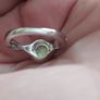 A beautiful 925 silver ring with a white lab opal surrounded by shining cubic zirconia. Image 5