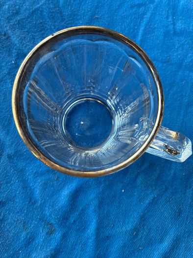 Vintage pint glass in leather holder