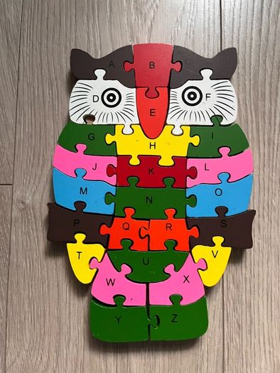 wooden jigsaw puzzle with numbers and letters