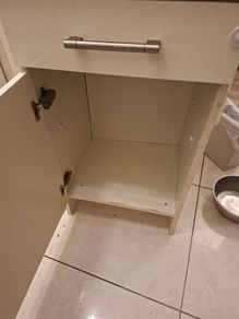 A free standing kitchen cupboard with drawer.