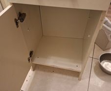 A free standing kitchen cupboard with drawer.