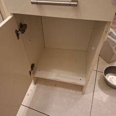 A free standing kitchen cupboard with drawer.