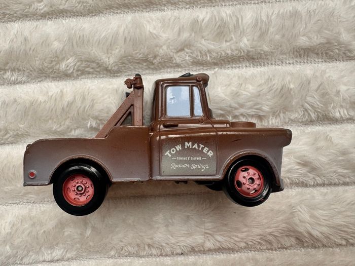 Disney Pixar Cars Radiator Springs Tow Mater Truck Diecast Metal Vehicle approx. 9.5 cm. length one of the back wheels is not working usad Please see photos