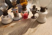 five minature oil lamps