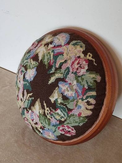 Vintage hand embroidered floral design on wooden base stool,