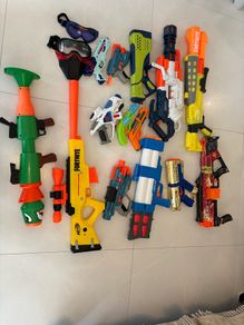 Selection of Toy guns with bullets and googles for sale