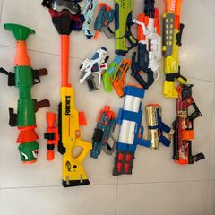 Selection of Toy guns with bullets and googles for sale