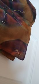 Hand painted, 100% silk scarf featuring a hand-rolled hem and custom metallic gutta detailing.