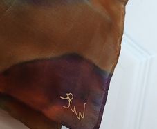 Hand painted, 100% silk scarf featuring a hand-rolled hem and custom metallic gutta detailing.