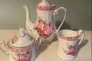 Vintage Porcelain small teapot sugar bowl and creamer set .       porcelain