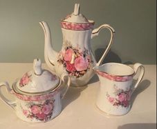 Vintage Porcelain small teapot sugar bowl and creamer set .       porcelain