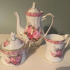 Vintage Porcelain small teapot sugar bowl and creamer set .       porcelain