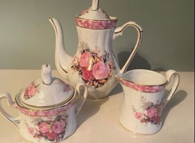 Vintage Porcelain small coffee or teapot sugar bowl and creamer set .       porcelain