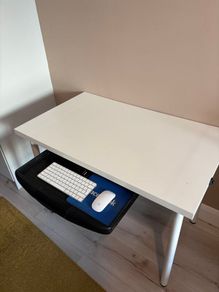 White desk with pull-out keyboard tray