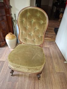 A Victorian Walnut upholstered Nursing Chair c1860 nicely Carved with Cabriole legs. It has Brass Castors.
