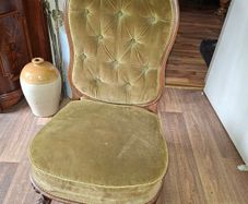 A Victorian Walnut upholstered Nursing Chair c1860 nicely Carved with Cabriole legs. It has Brass Castors.