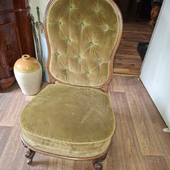 A Victorian Walnut upholstered Nursing Chair c1860 nicely Carved with Cabriole legs. It has Brass Castors.