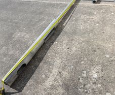 Galvanised lighting pole and T-bar.