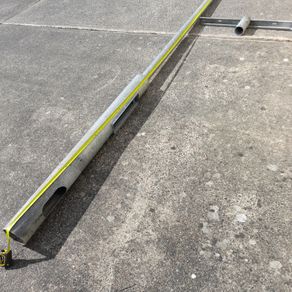 Galvanised lighting pole and T-bar.