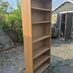 Tall oak-effect bookcase