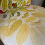 leaf and berry patterned lounge chair Image 3