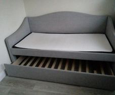 Single  bed with a mattress and pull-out guest bed