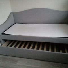 Single  bed with a mattress and pull-out guest bed