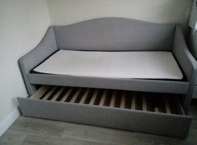 Single  bed with a mattress and pull-out guest bed