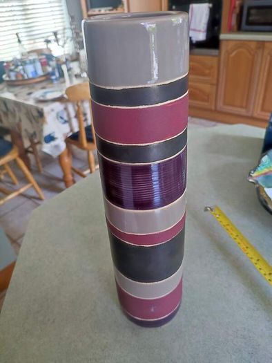 Lovely tall vase  handcrafted slight variations occur giving each product its own uniqueness.